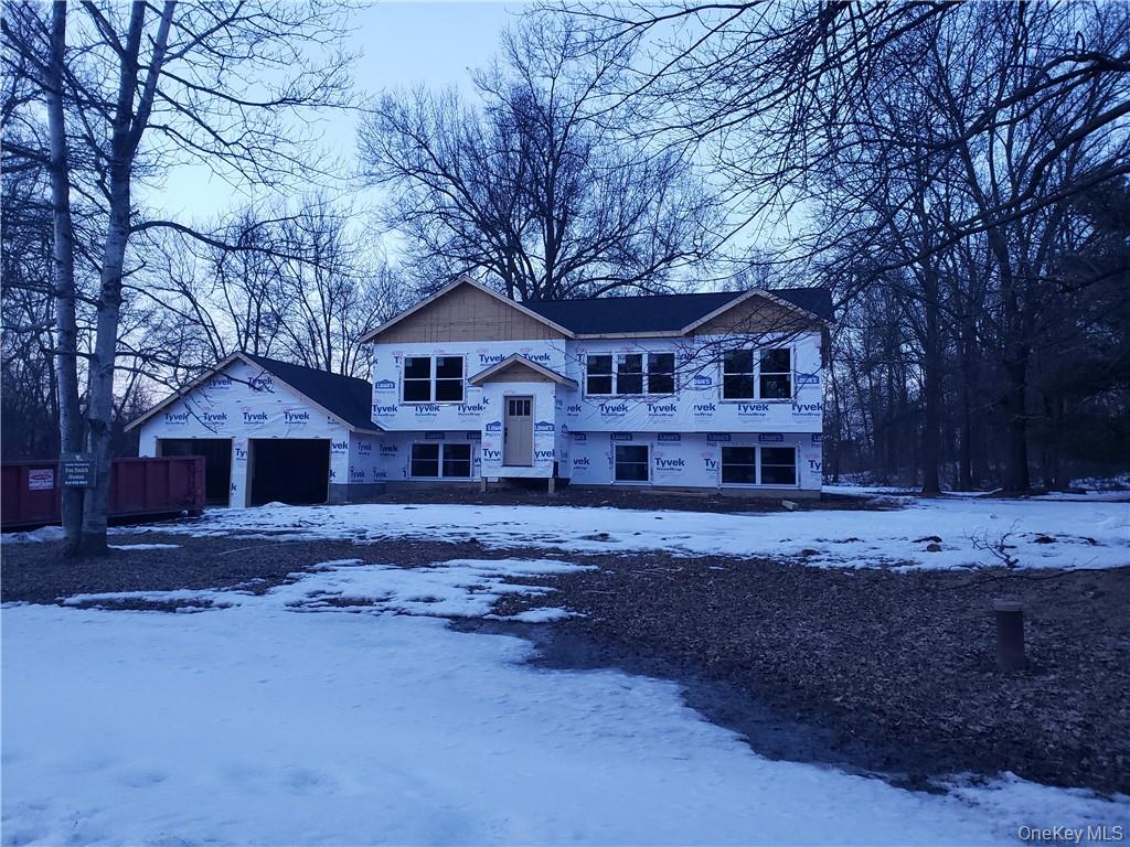 Two-story home — full gut renovation, siding stripped, windows removed