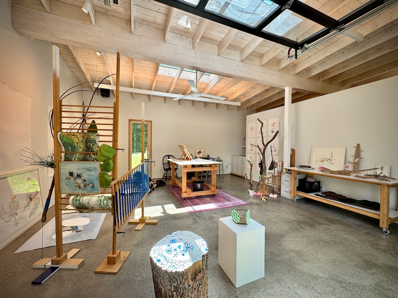 Studio interior — clerestory skylights flooding the art workspace